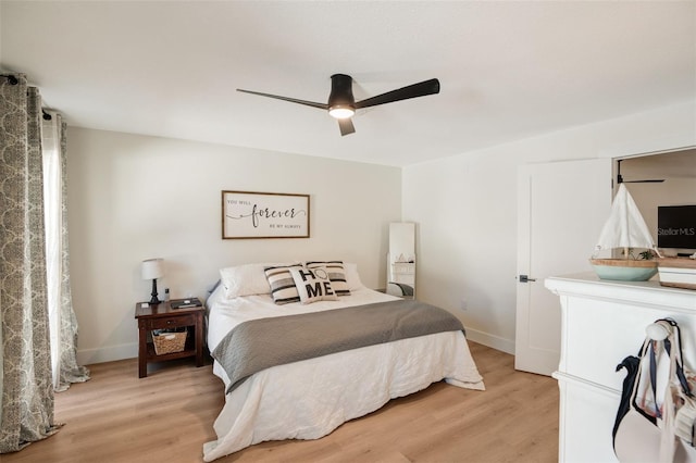 bedroom with ceiling fan and light hardwood / wood-style floors