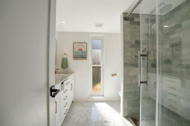 bathroom with vanity, toilet, and a shower with shower door