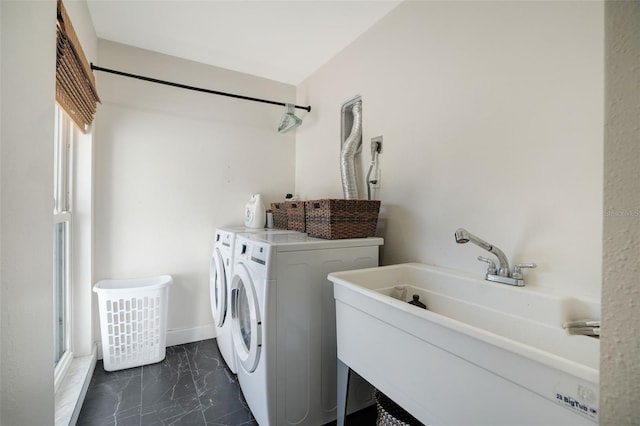 laundry area featuring washer and clothes dryer and sink