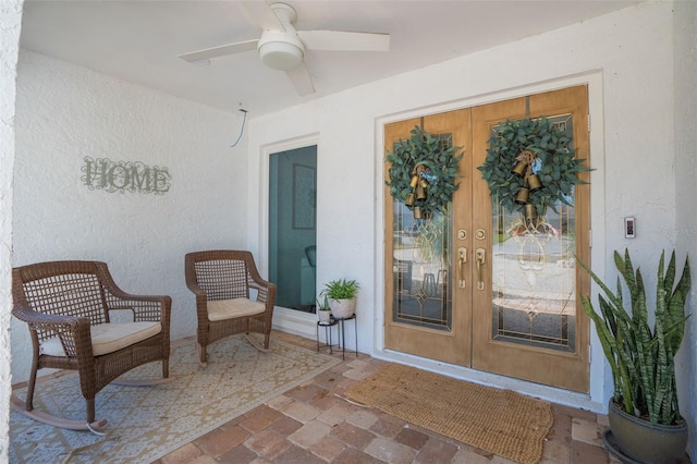 entrance to property with french doors and ceiling fan