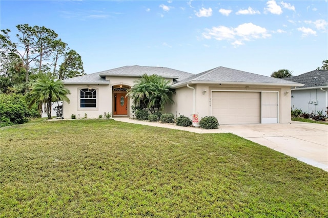 view of front of house featuring a front yard and a garage