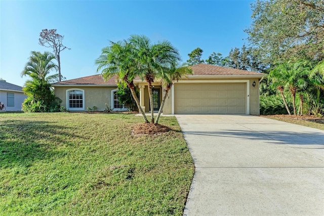 view of front of house featuring a front yard and a garage