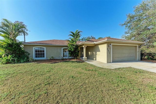 ranch-style house featuring a garage and a front lawn