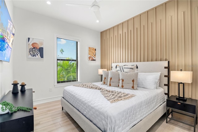 bedroom featuring light hardwood / wood-style floors and ceiling fan