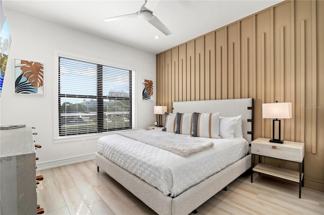 bedroom featuring light wood-type flooring and ceiling fan