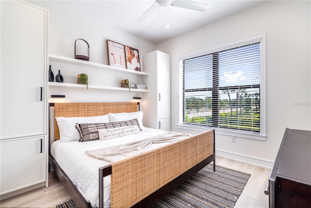 bedroom featuring light hardwood / wood-style floors and ceiling fan