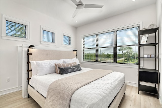 bedroom featuring ceiling fan and light hardwood / wood-style flooring