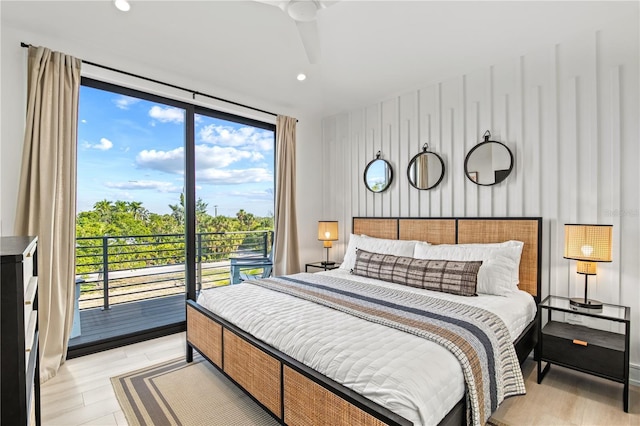 bedroom with floor to ceiling windows, ceiling fan, light hardwood / wood-style flooring, and access to exterior