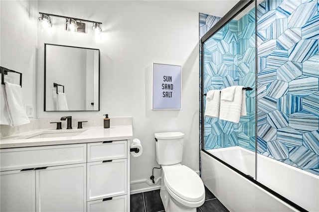 full bathroom featuring shower / bath combination with glass door, tile patterned floors, vanity, and toilet