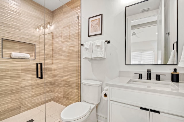 bathroom with vanity, toilet, an enclosed shower, and a chandelier