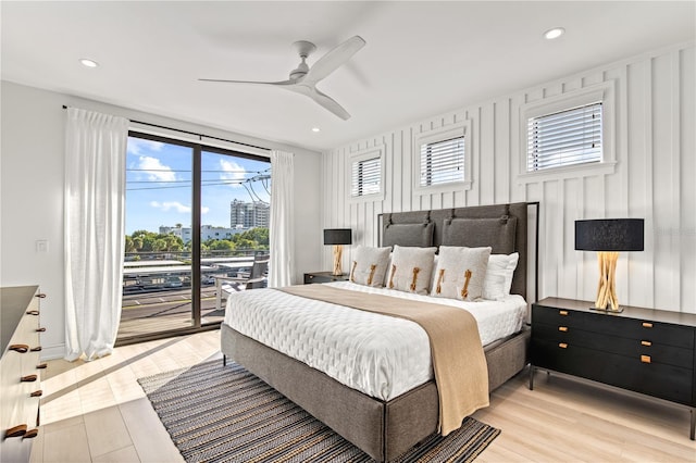 bedroom with access to exterior, light hardwood / wood-style floors, and ceiling fan