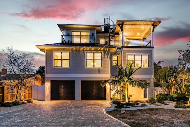 view of front of property with a balcony and a garage