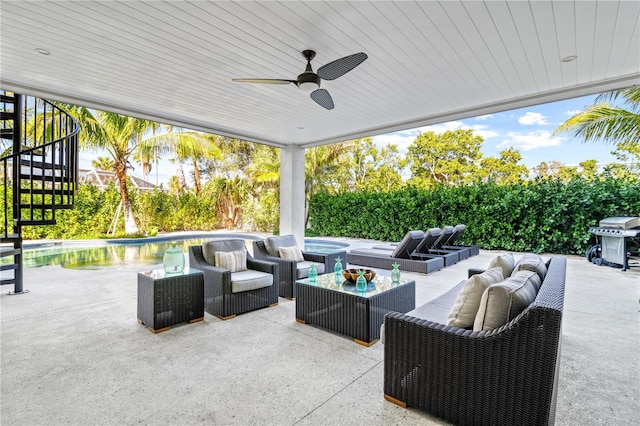 view of patio / terrace featuring grilling area, an outdoor living space, a swimming pool with hot tub, and ceiling fan