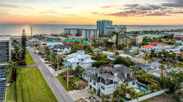 aerial view at dusk with a water view