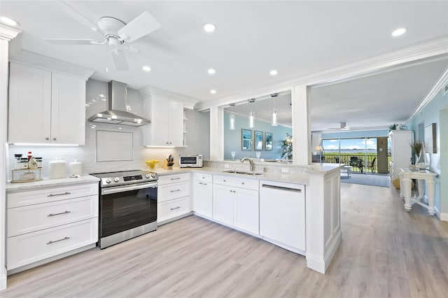 kitchen featuring stainless steel electric range, white dishwasher, kitchen peninsula, wall chimney exhaust hood, and white cabinetry