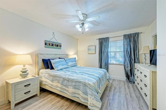 bedroom featuring ceiling fan and light hardwood / wood-style flooring