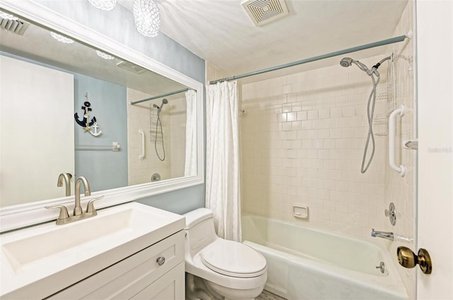 full bathroom featuring shower / bathtub combination with curtain, vanity, and toilet