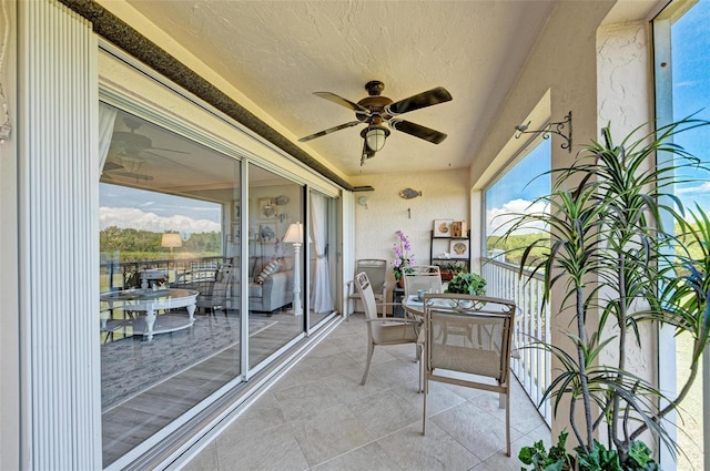 sunroom / solarium with ceiling fan