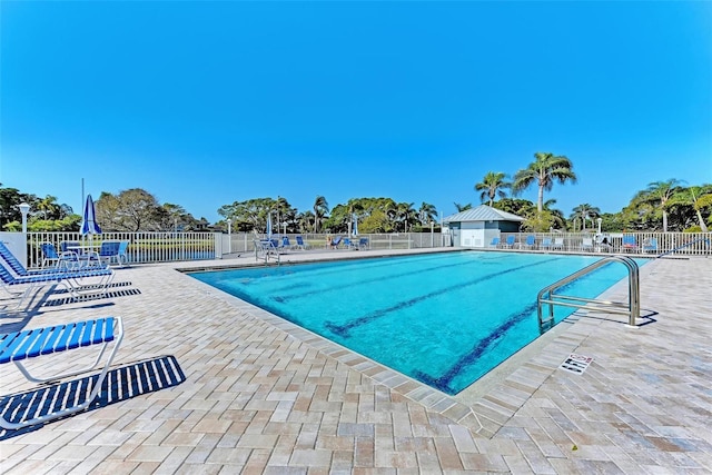 view of swimming pool with a patio