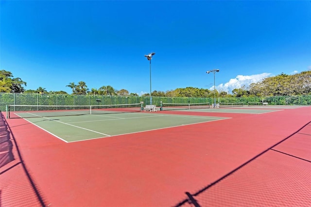 view of tennis court with basketball court