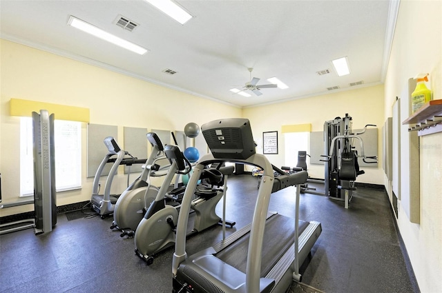 exercise room featuring ceiling fan and crown molding