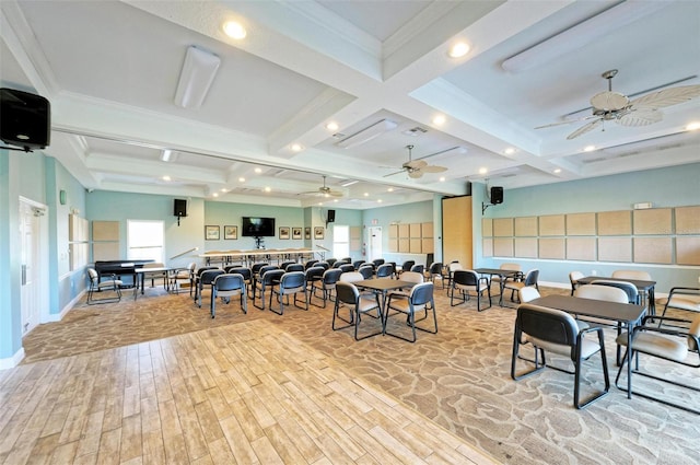 dining space featuring beamed ceiling, light hardwood / wood-style floors, ceiling fan, and crown molding