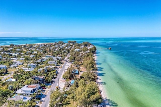 birds eye view of property with a view of the beach and a water view