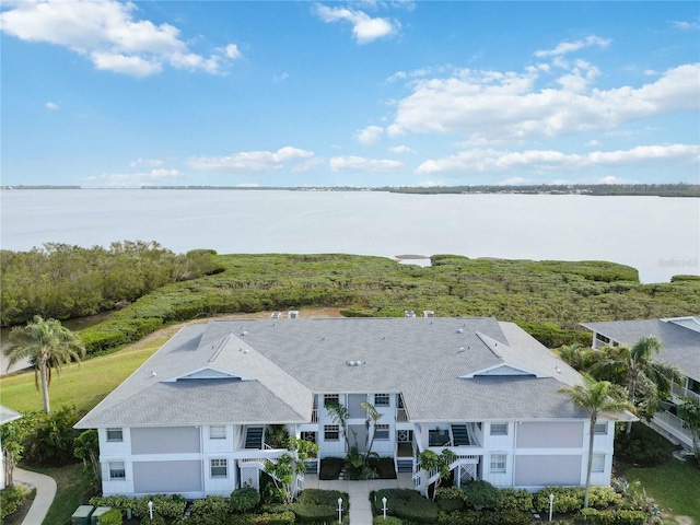 drone / aerial view with a water view