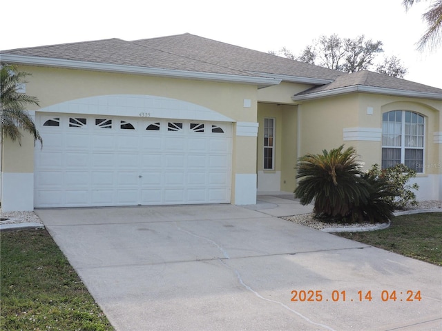 ranch-style house featuring a garage