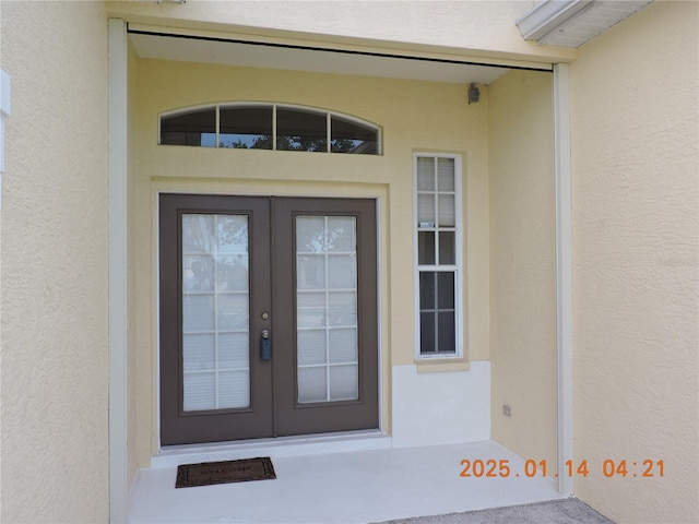 doorway to property featuring french doors