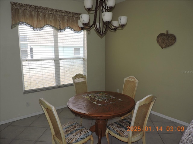 tiled dining room with plenty of natural light and a notable chandelier