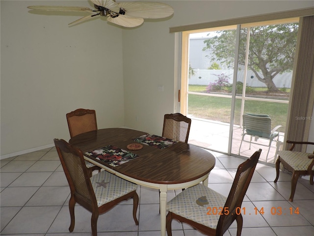 dining space featuring ceiling fan and light tile patterned flooring