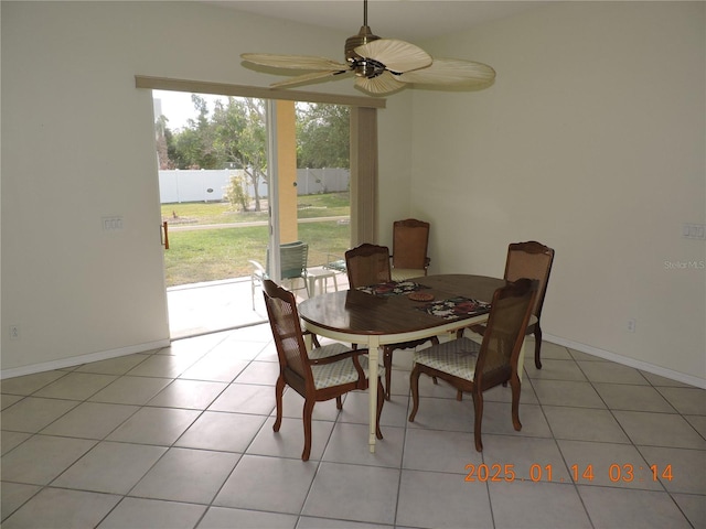 dining room with light tile patterned flooring and ceiling fan