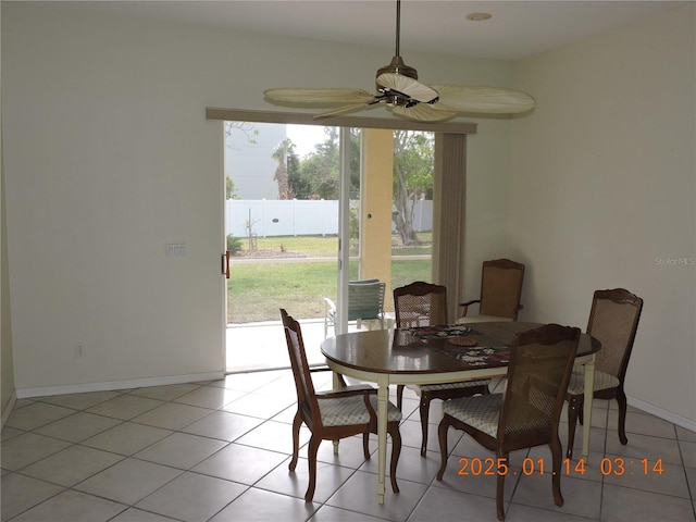 dining space with ceiling fan and light tile patterned floors