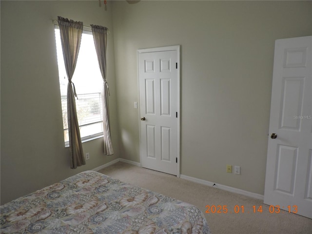 unfurnished bedroom featuring light colored carpet