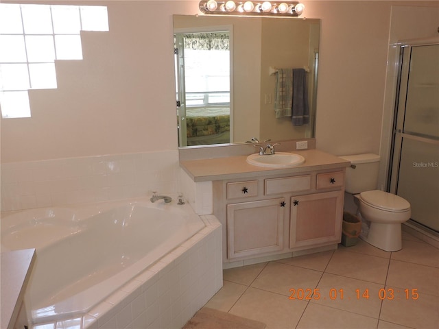 full bathroom with toilet, tile patterned flooring, vanity, and independent shower and bath