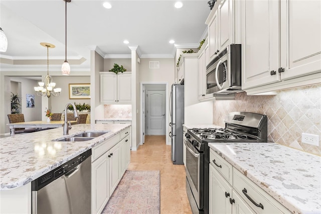 kitchen with appliances with stainless steel finishes, white cabinetry, and sink