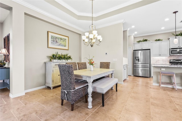 dining room featuring a raised ceiling, crown molding, and a notable chandelier