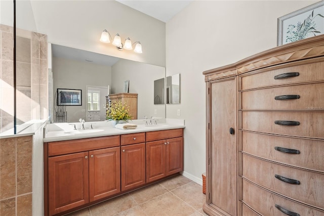 bathroom with tile patterned flooring and vanity