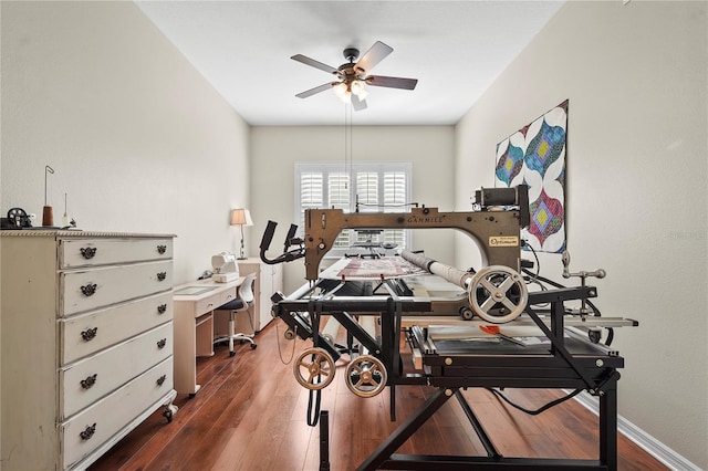 bedroom with ceiling fan and dark wood-type flooring