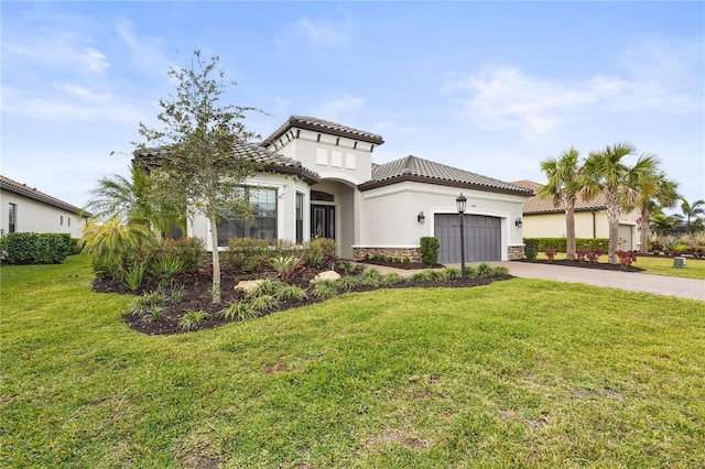 mediterranean / spanish-style home featuring a garage and a front lawn