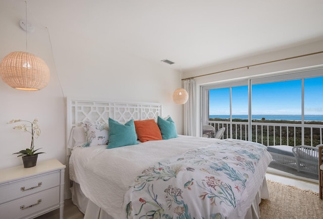 bedroom featuring a water view