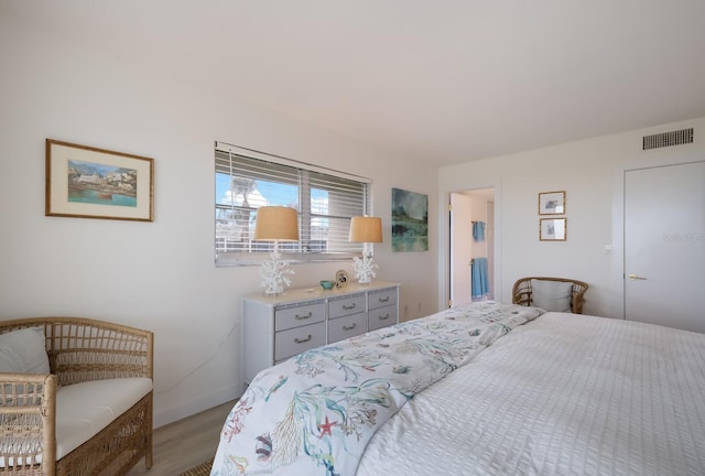 bedroom with light wood-type flooring