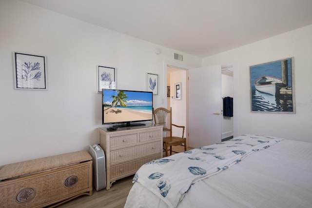 bedroom with light hardwood / wood-style flooring