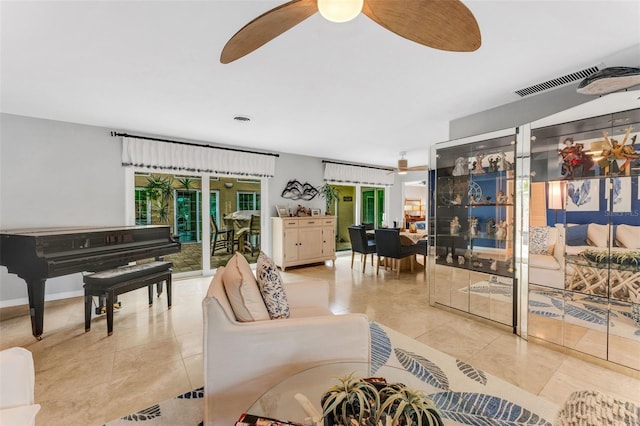 living room featuring light tile patterned floors and ceiling fan