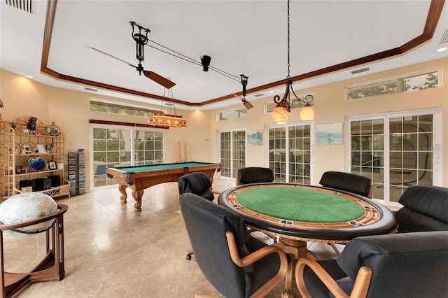 playroom with a tray ceiling, ornamental molding, billiards, and french doors