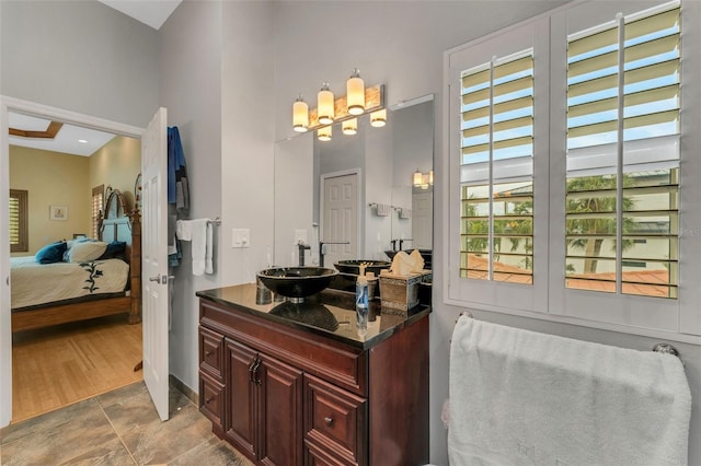 bathroom with vanity and a towering ceiling