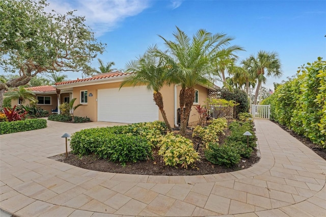 view of side of property with a garage