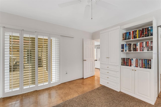 unfurnished bedroom featuring ceiling fan