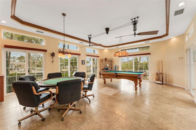 rec room with a wealth of natural light, visible vents, and a raised ceiling